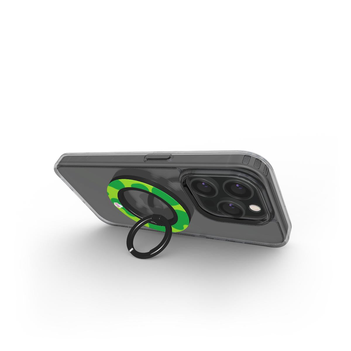 Bague de téléphone magnétique motif dinosaure vert, en situation d'usage