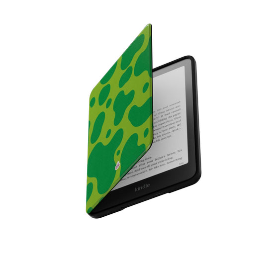 Coque Kindle motif dinosaure vert, rabat ouvert laissant apparaître la liseuse Kindle